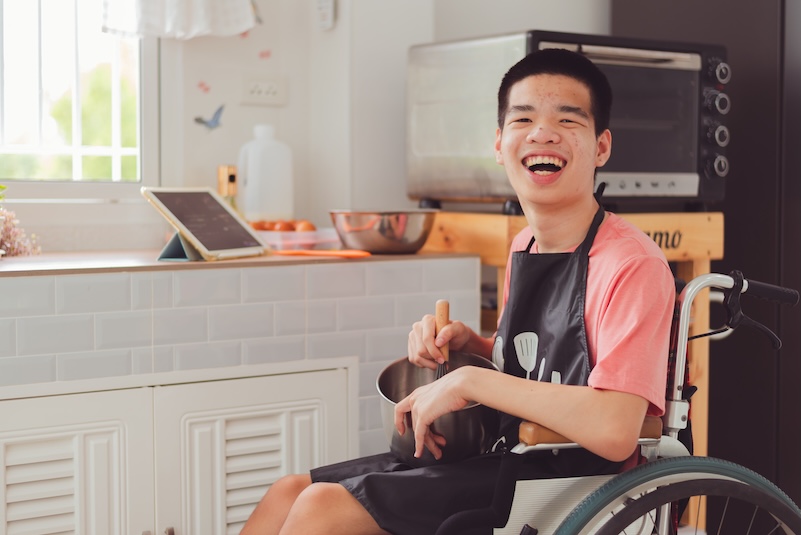 Children in wheelchair smiling